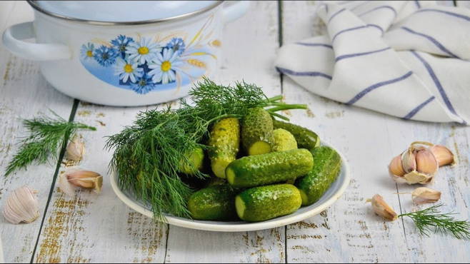 Lightly salted cucumbers in a saucepan