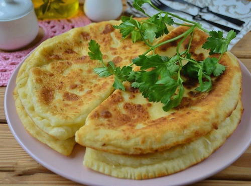 Khachapuri with cottage cheese in a pan