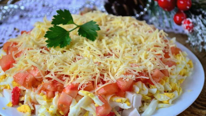 Salad with crab sticks, tomatoes and eggs