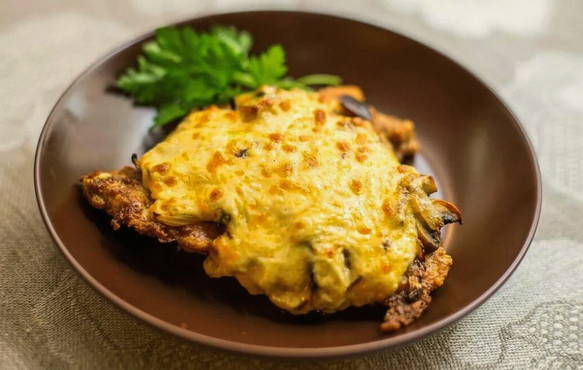 Pork chops in the oven with mushrooms