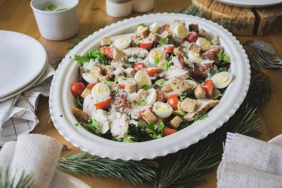 Caesar salad with mayonnaise and tomatoes