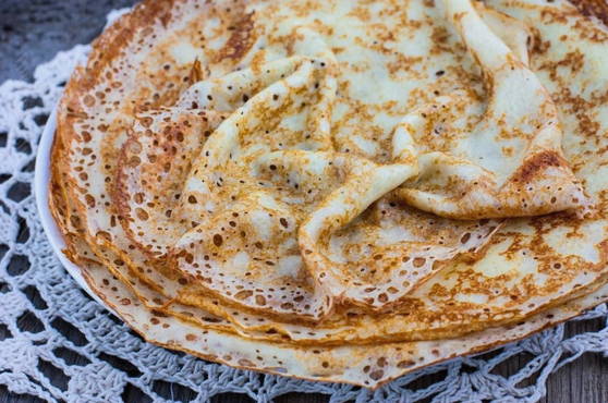 Openwork pancakes with milk