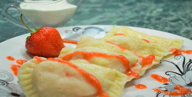 Dumplings with strawberries on the water