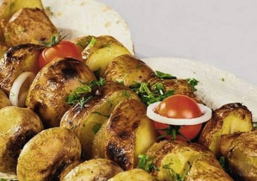 Grilled potatoes in marinade