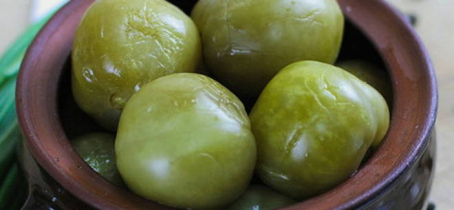 Barrel green tomatoes in a bucket