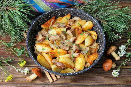 Fried potatoes with butter in a pan