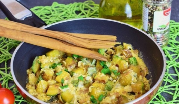 Zucchini casserole with eggs in a pan