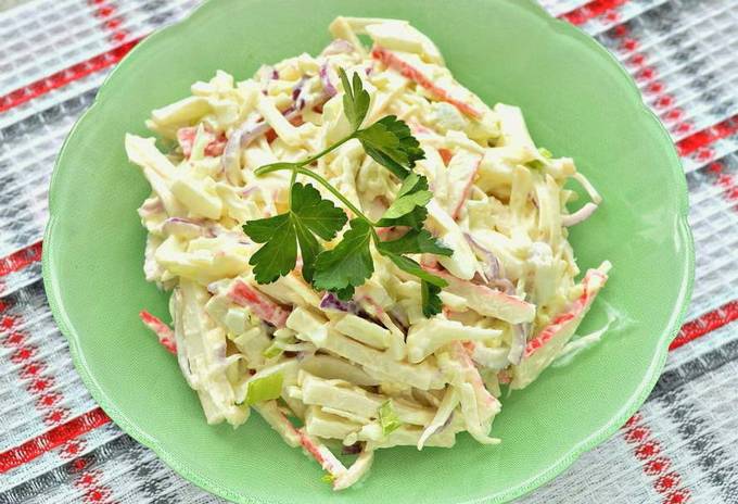 Salad with squid, crab sticks, egg and cheese