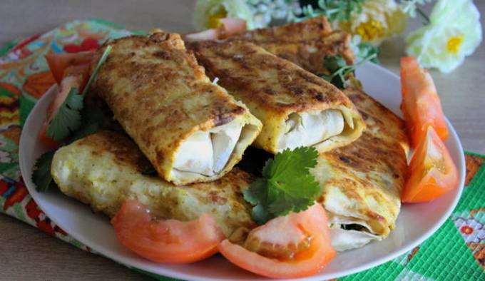 Lavash pies with onions and eggs in a pan