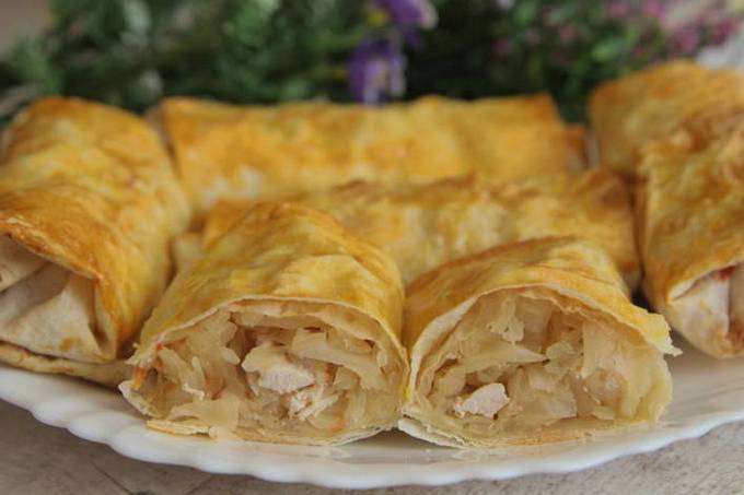 Lavash pies with chicken in a pan