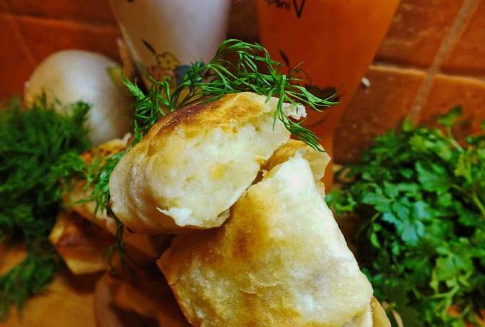 Lavash pies with potatoes in a pan