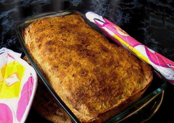 Lavash pie with cheese, cottage cheese and herbs in the oven