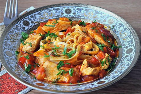 Lagman with chicken in a saucepan