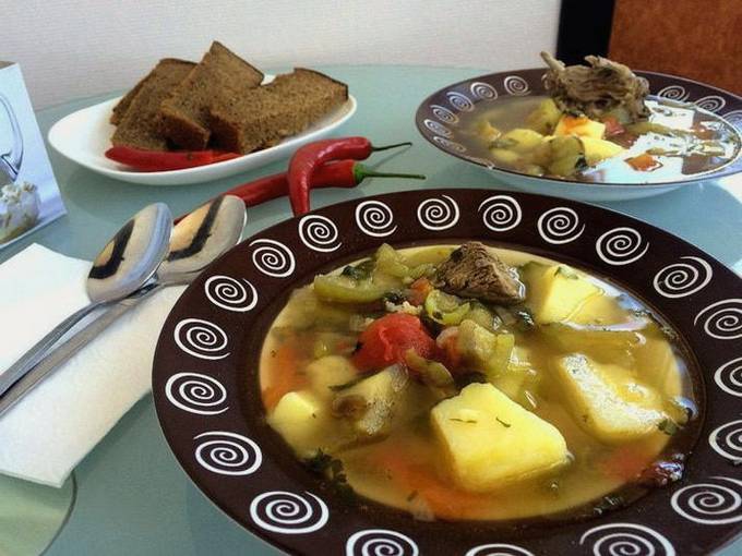 Beef shulum with potatoes on the stove