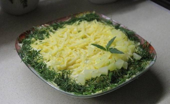 Puff salad with chicken, pineapple, cheese and mushrooms