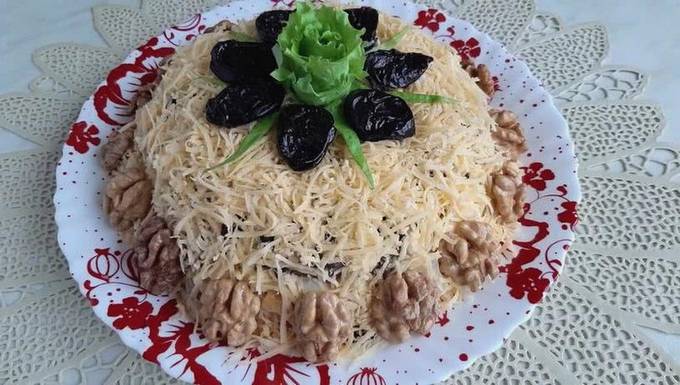 Salad with chicken, pineapple, cheese, walnuts and prunes