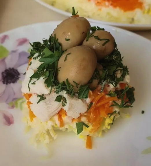 Salad with chicken, mushrooms, potatoes and carrots