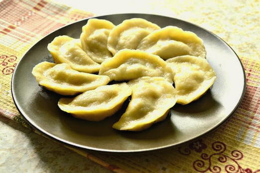 Dumplings with raw potatoes and mushrooms