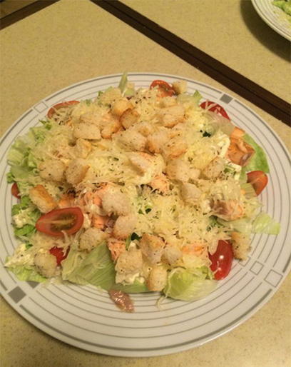 Caesar salad with salmon and croutons