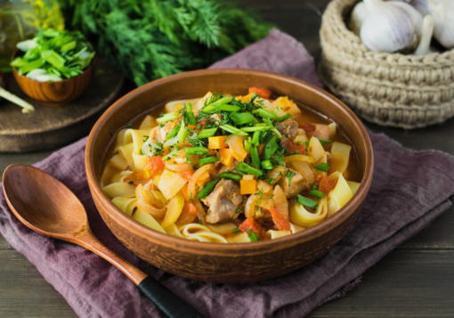 Uzbek pork lagman in a cauldron