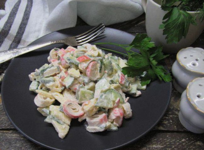 Salad with crab sticks, cucumber and apple