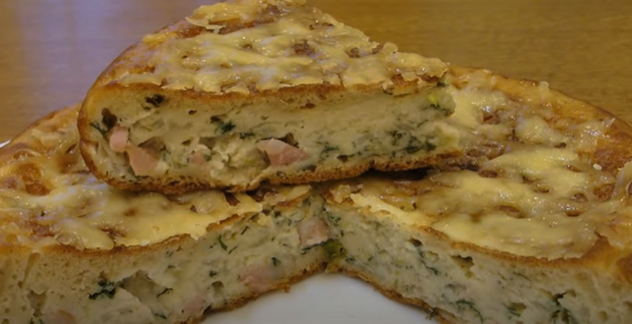 Cabbage jellied pie on the stove in a frying pan