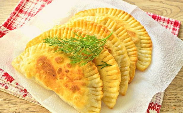 Chebureks stuffed with minced chicken