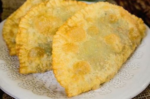 Homemade pasties on kefir with minced meat in a pan