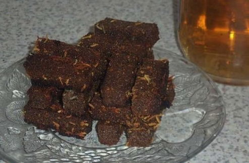 Beer croutons from black bread with garlic in a pan