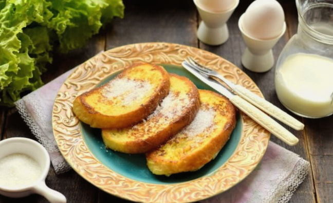 Sweet croutons from a loaf with egg and milk in a pan