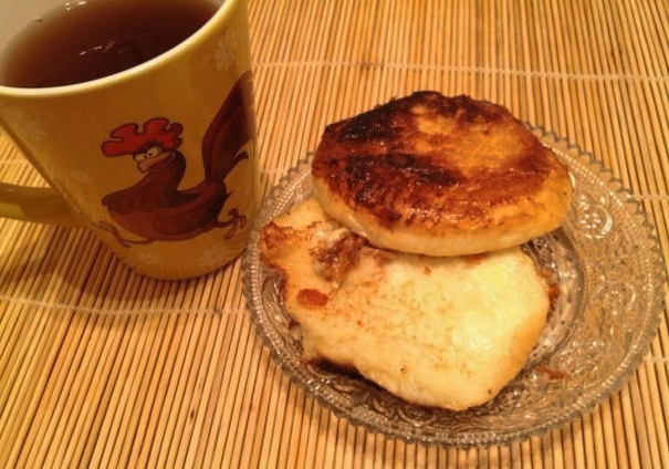 White bread croutons with egg, milk and cheese in a pan