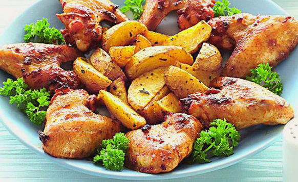 Wings with potatoes in foil in the oven