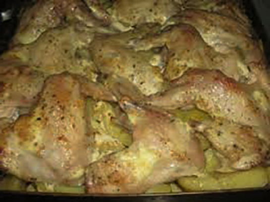 Wings with potatoes and vegetables in the oven