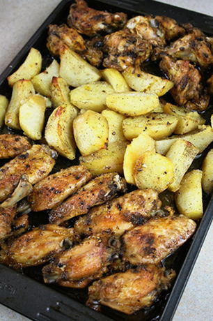 Chicken wings in mayonnaise with potatoes in the oven