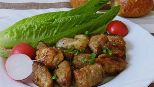 Pieces of pork with soy sauce in a pan