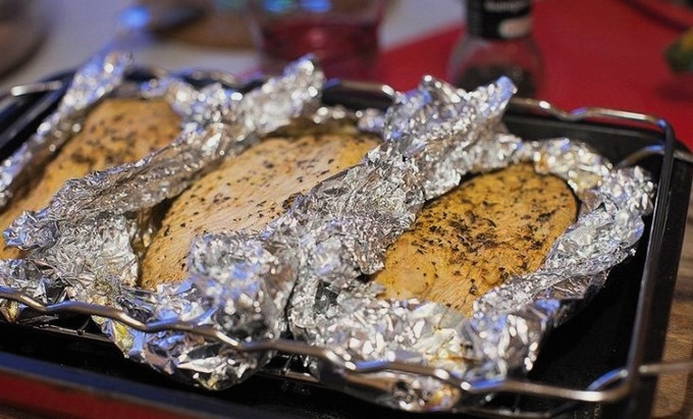 Chunks of turkey in foil in the oven