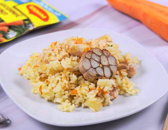 Pilaf with chicken in a glass dish in the oven