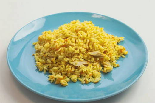 Pilaf with chicken in a cauldron in the oven