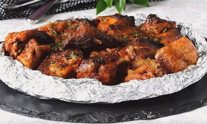 Pork pieces baked in foil in the oven