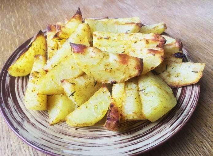 Potato wedges with sour cream in the oven