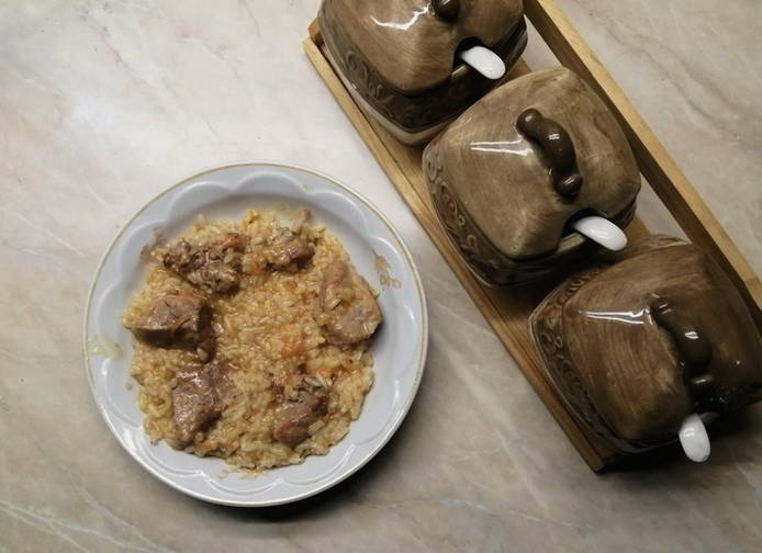 How to cook pork pilaf in a saucepan on the stove