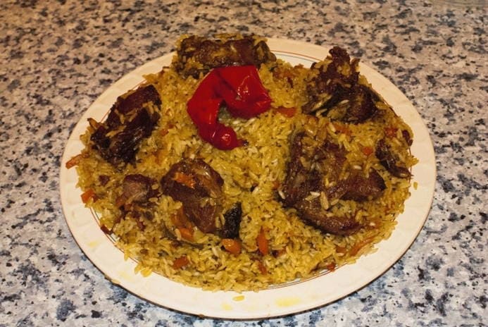 Pilaf with lamb in a wok