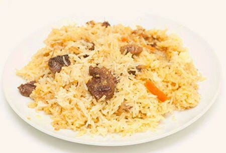 Pilaf with beef in a wok