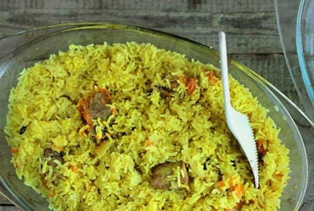 Pork pilaf in a cauldron in the oven