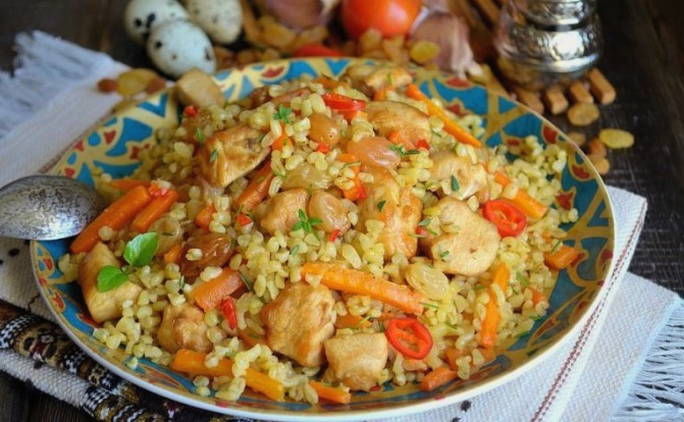 Bulgur pilaf with beef in a cauldron