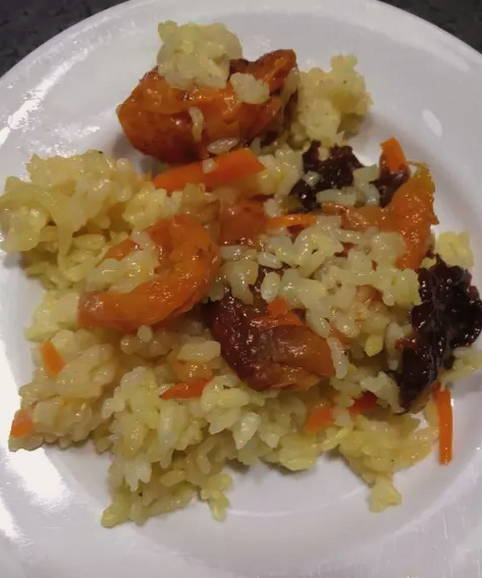 Pilaf with dried apricots, prunes and raisins