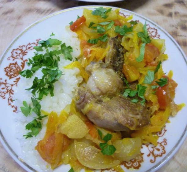 Turkey steak in a pan with vegetables