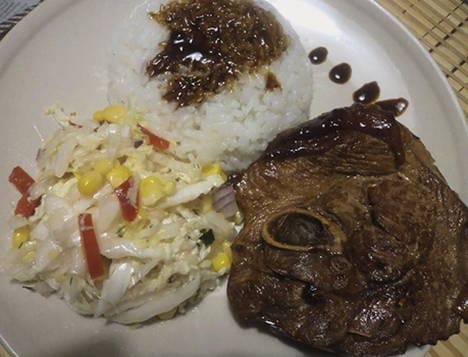 Turkey steak with bone in a pan