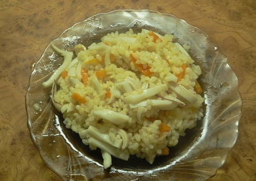 Pilaf with squid in a pan