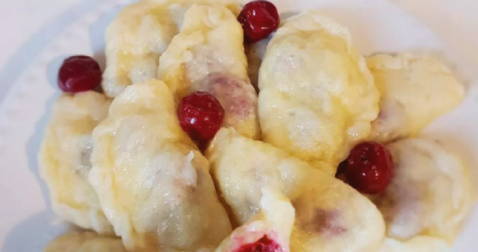 Dumplings with cherries in milk